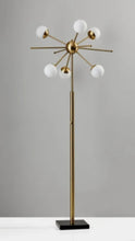 Brass standing floor lamp with eight white globe shades and radial arms