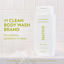 Native body wash bottle on side, white with green “Sulfate free” and scent text