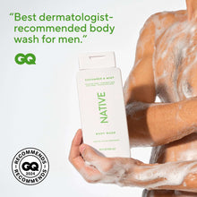 Cucumber & Mint body wash bottle held in hand, white bottle with green Native label