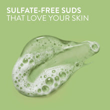 Thick green-tinted suds for body wash in a swirled pile