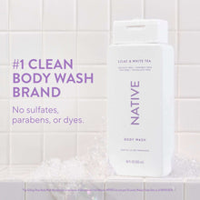 Tall body wash bottle labeled Lilac & White Tea, sulfate-free, paraben-free