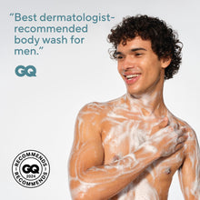 Body wash lather on bare male chest and neck, creamy white foam