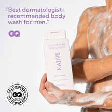 Native body wash bottle held in hands with foamy lather on skin