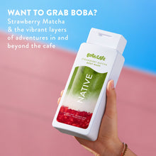 Hand holding Native body wash bottle with BoBa Cafe Strawberry Matcha label