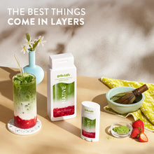 Body wash bottles with matcha and fruit boba-style drink cups on a tabletop