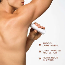 Deodorant stick held near underarm on person, showing smooth glide