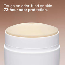 Deodorant container lid close-up with smooth cream-colored top