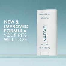 Native deodorant stick standing upright, white with teal “NATIVE” and “Cashmere & Rain”