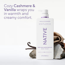 Vanilla & Cashmere body wash bottle with purple pump beside folded beige cloth.