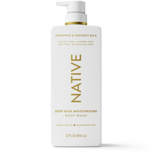 Moisturizing body wash bottle with gold label, pineapple & coconut milk, and pump