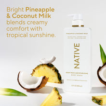 Moisturizing body wash bottle with gold pump with pineapple and coconut pieces