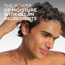 Man with wet curly hair, showing moisturizing hair care benefit
