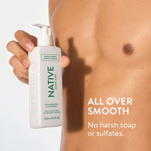 Native shave cream bottle with pump held in hand, shaving foam on skin