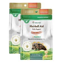 Cat hairball aid supplement sachets, green-and-beige packs with pumpkin graphic