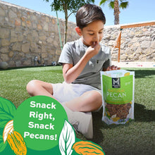 Natural pecan halves pouch, 32 oz, upright in front of seated child