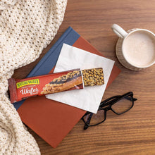 Peanut butter chocolate wafer bars with coffee cup on brown paper