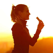 Handheld wafer bar snack piece being eaten