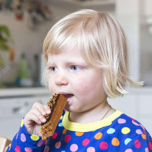 Child holding and eating a wafer bar snack