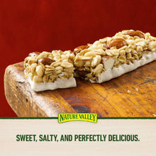 Almond granola bars with oat crumble topping on a wooden surface