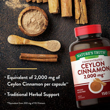 Ceylon cinnamon supplement bottle beside cinnamon bark and ground powder on a dark surface