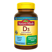 Vitamin D3 supplement bottle with yellow cap, Nature Made label and softgels front view