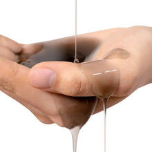 Shampoo stream being poured onto an open hand