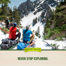 Nature Valley promotional hiking scene with 'Never Stop Exploring' badge and logo