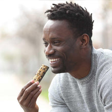 Nature Valley protein chewy bar being eaten, peanut butter dark chocolate flavor