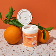 Open Vitamin C brightening moisture cream jar with pale cream inside and white lid.