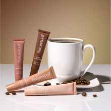 Assorted tinted lip butter tubes with caps, laid out in a small group