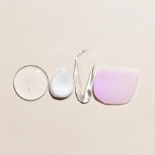 Skincare set bottles and jars: round cream jar, dropper serum, and purple soap bar