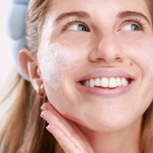 Moisturizing gel cream applied to cheeks and jaw with a smooth white layer