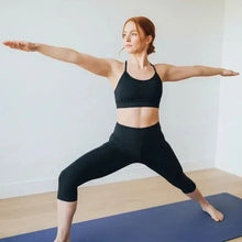 Blue yoga mat with textured surface used for yoga practice