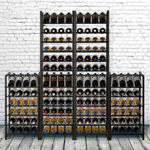 Multiple metal wine bottle racks with many bottles in cubby shelves, dark finish