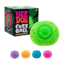 Green fuzzy flower power fidget ball with smiley face, beside retail box