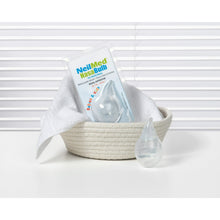 NeilMed NasaBulb nasal aspirator in beige cloth bowl, clear suction bulb