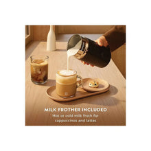 Foamy cappuccino in glass cups with milk being poured for frother