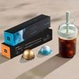 Nespresso Vertuo Pop+ bundle with black box, capsules, and iced drink bottle