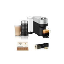 Stainless and black coffee maker with built-in milk frother and capsule holder
