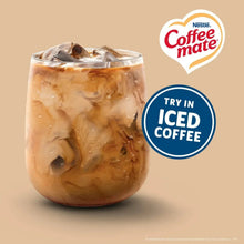 Coffee-mate creamer singles in iced coffee glass with ice-cold badge.