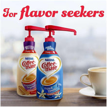 Two Coffee-mate liquid creamer pump bottles with French vanilla on a table