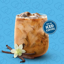 Iced coffee mug with creamy brown drink and ice cubes