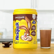 Chocolate drink mix jar with Nesquik rabbit, chocolate flavor, and glass of drink