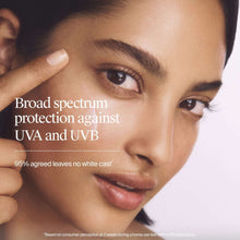 Broad spectrum SPF 50 face moisturizer applied as a white cream streak on cheek.
