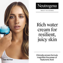 Face cream jar held near cheek, with small Hydro Boost container visible