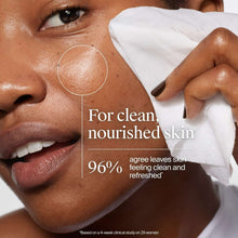 Makeup remover wipe held to face with clean, refreshed skin text