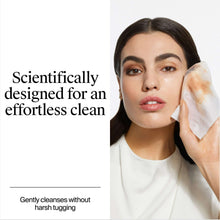 Woman using a makeup remover wipe on her cheek