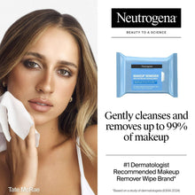 Makeup remover wipes used on face, with white cleansing wipe in hand