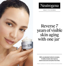 Neutrogena Rapid Wrinkle Repair Retinol cream jar held near the face