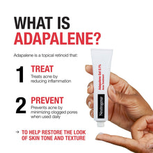 Adapalene 0.1% acne treatment gel tube held in hand.